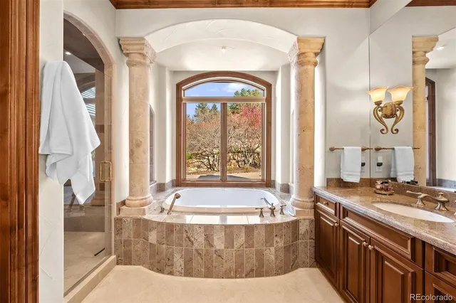 a bath tub sitting next to a bathroom sink