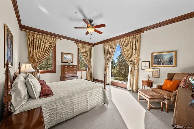 a bedroom with a bed couch and a window