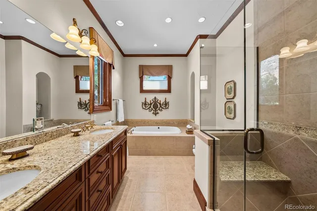 a spacious bathroom with a granite countertop sink mirror and shower