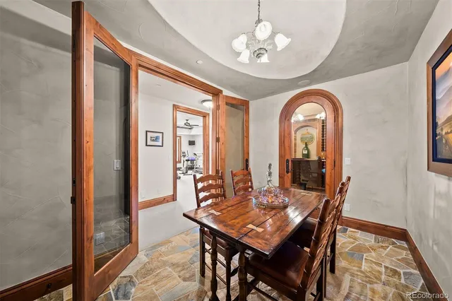 a media room with lots of chairs and a projector screen