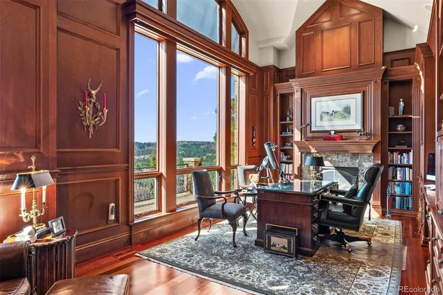 a view of a dinning room with large windows