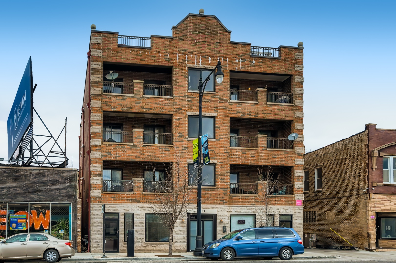a front view of a building with parking space