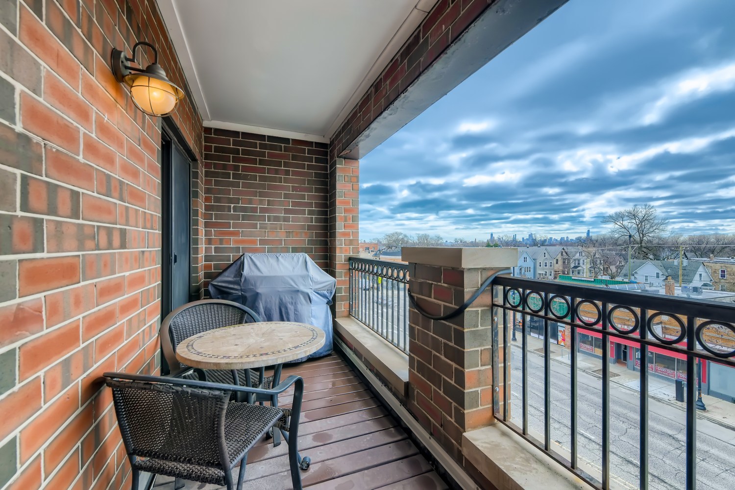 3114 West Irving Park Road, Unit 4E Chicago, IL 60618 - Photo 11 of 18 a view of a balcony with chairs