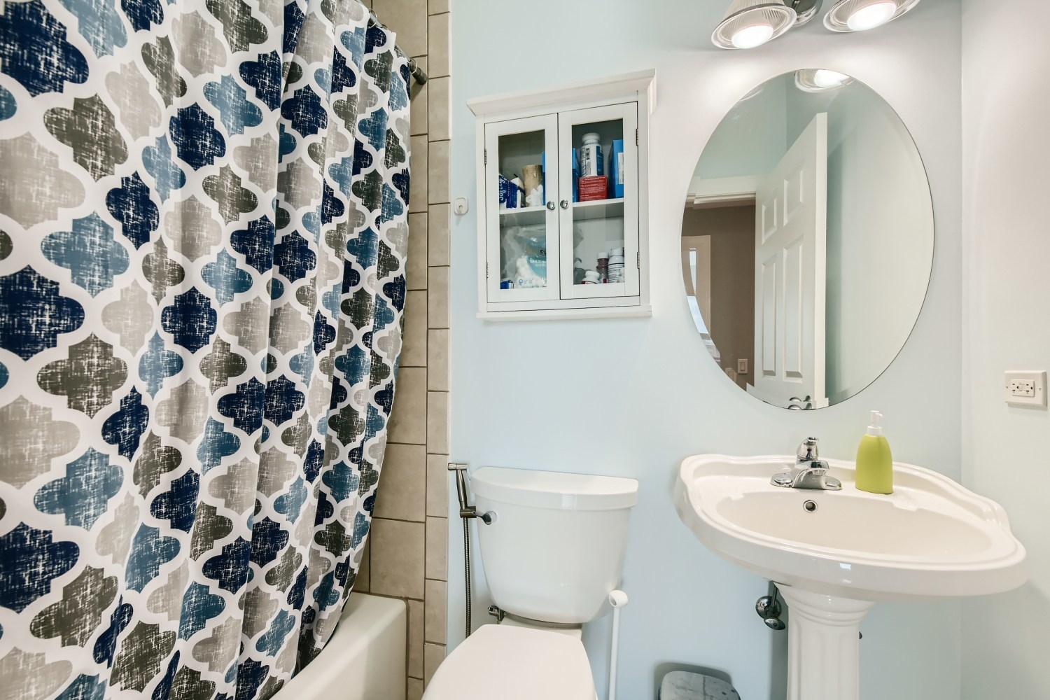 3114 West Irving Park Road, Unit 4E Chicago, IL 60618 - Photo 13 of 18 a bathroom with a sink toilet and mirror