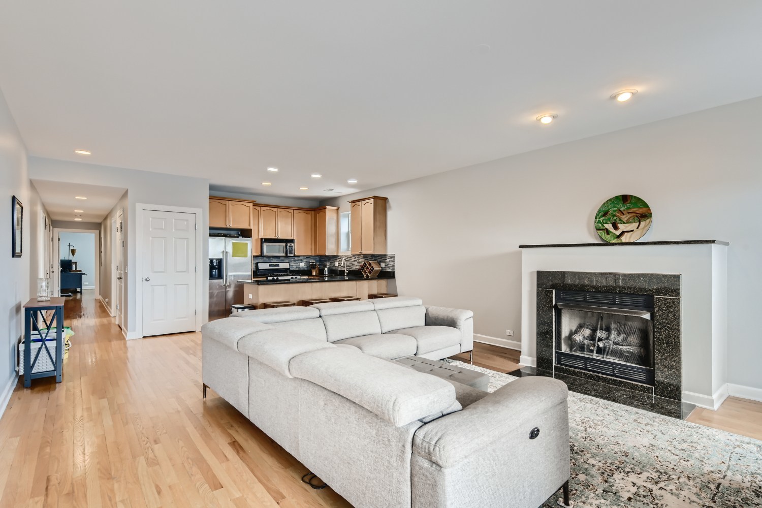 3114 West Irving Park Road, Unit 4E Chicago, IL 60618 - Photo 4 of 18 a living room with furniture and a fireplace