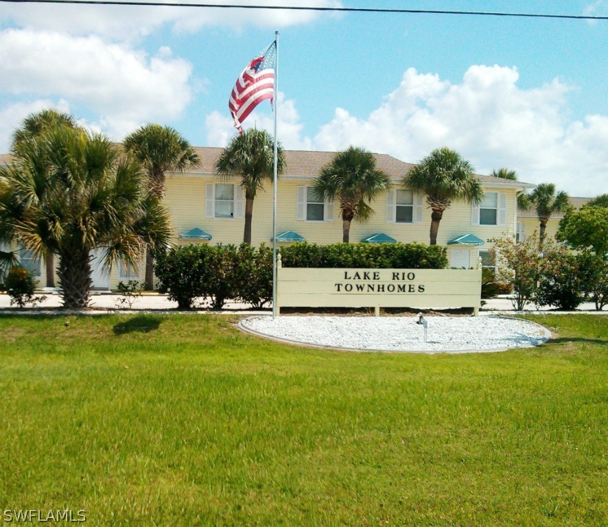 26310 Rampart Boulevard, Unit 505E Punta Gorda, FL 33983 - Photo 1 of 17 a view of a house with swimming pool and chair