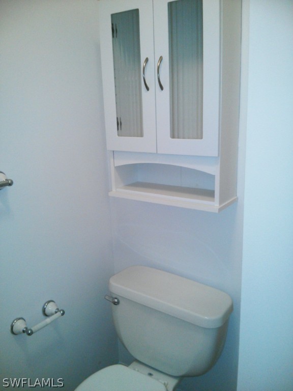 26310 Rampart Boulevard, Unit 505E Punta Gorda, FL 33983 - Photo 12 of 17 a bathroom with a toilet and a sink