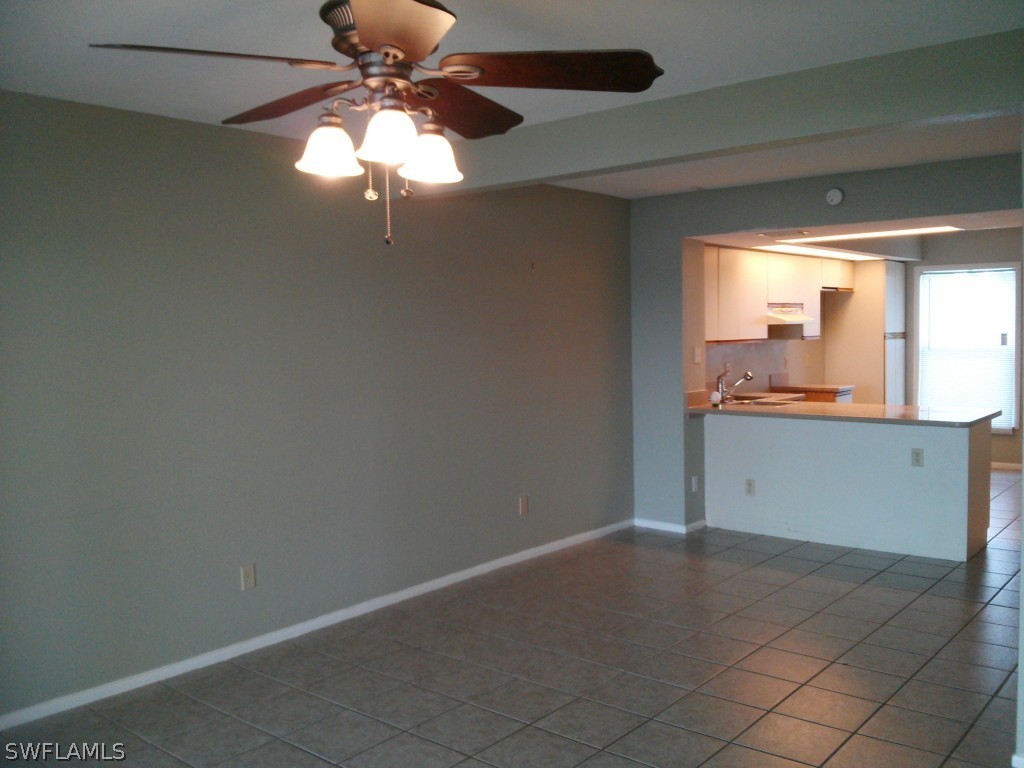 26310 Rampart Boulevard, Unit 505E Punta Gorda, FL 33983 - Photo 4 of 17 a view of a kitchen with a dishwasher and a window