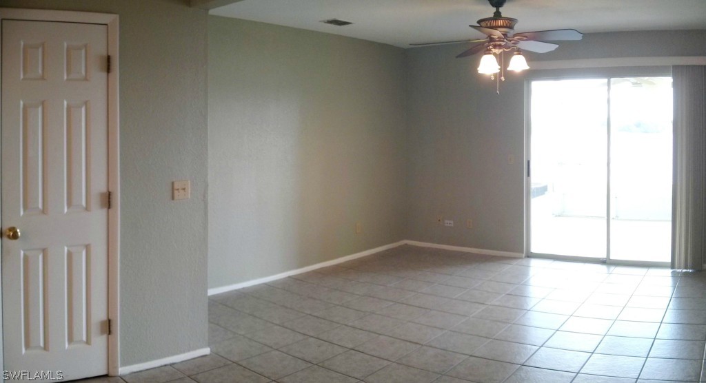 26310 Rampart Boulevard, Unit 505E Punta Gorda, FL 33983 - Photo 8 of 17 an empty room with fan and windows