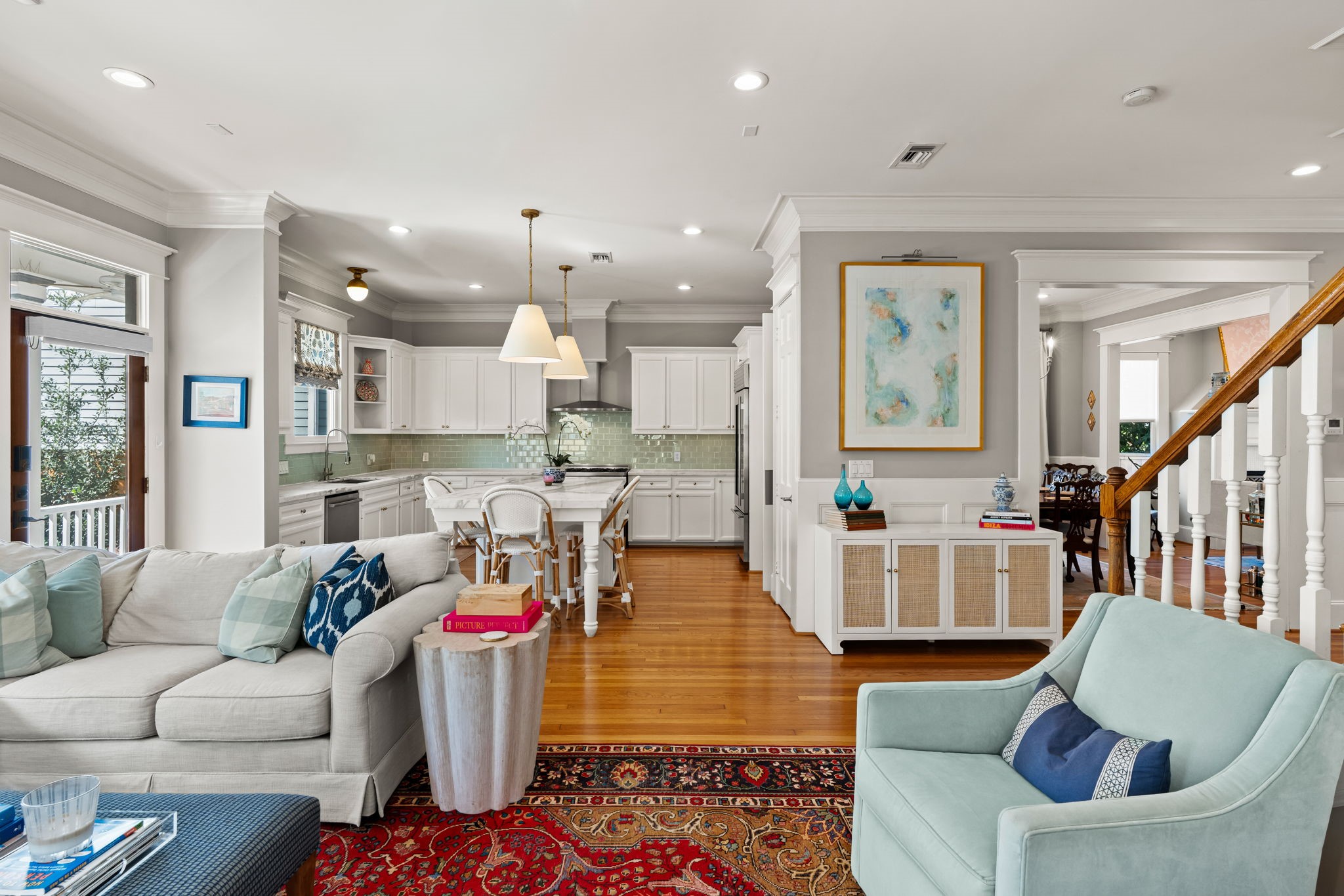 1236 Omar Street Houston, TX 77008 - Photo 12 of 50 The open transition from living to kitchen creates effortless connectivity for daily living and entertaining. Ample windows along the rear of the home enhance brightness and visual space.