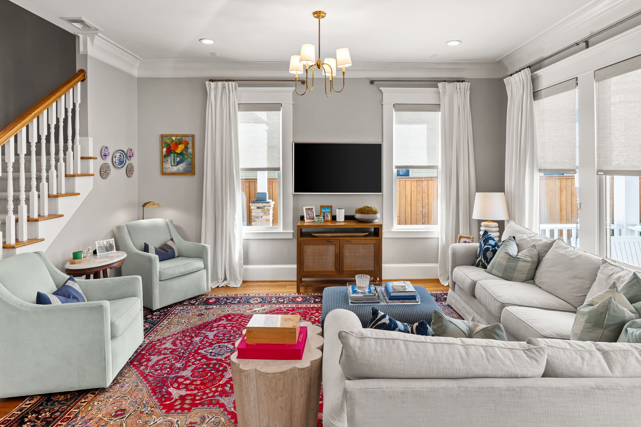 1236 Omar Street Houston, TX 77008 - Photo 18 of 50 Hardwood flooring, crown molding, and recessed lighting continue throughout the open living areas. The layout allows for comfortable seating while maintaining clear sightlines to the kitchen and outdoor access.