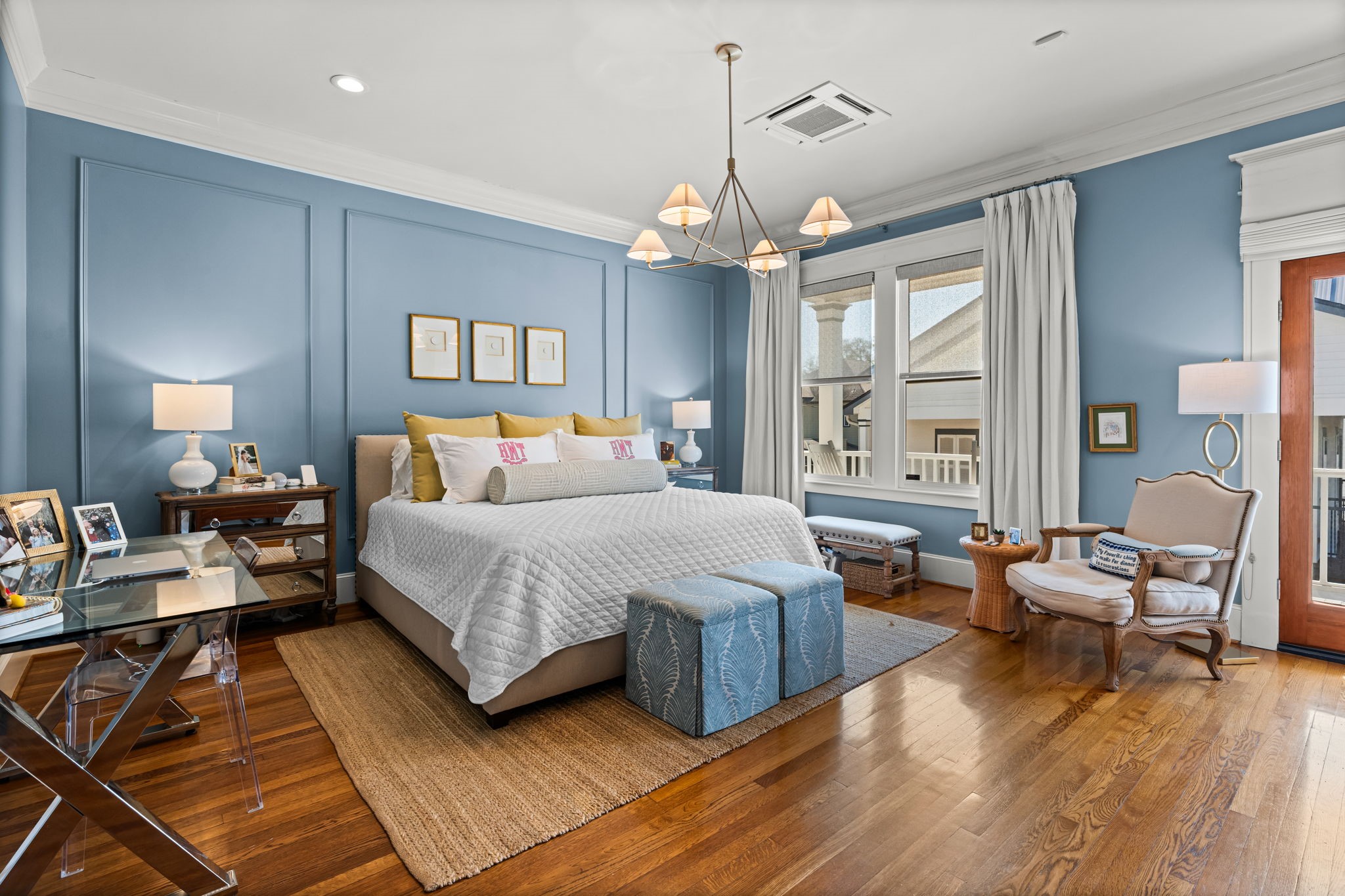 1236 Omar Street Houston, TX 77008 - Photo 20 of 50 The spacious primary bedroom features hardwood flooring, detailed crown molding, private balcony and abundant natural light. Large windows and elevated ceilings create an airy retreat with refined architectural character.