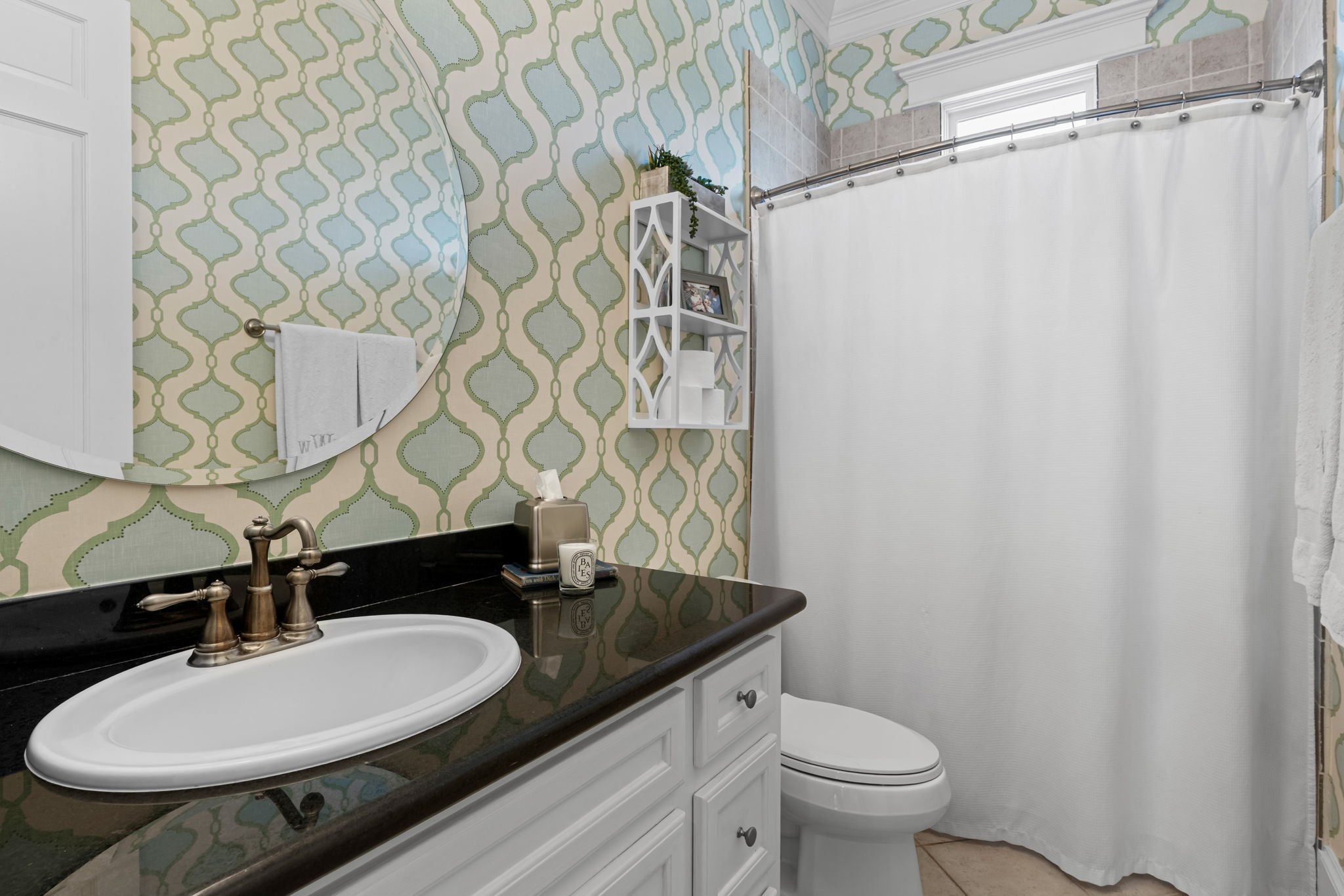 1236 Omar Street Houston, TX 77008 - Photo 26 of 50 This full bath showcases granite countertops, classic cabinets & wallpaper.