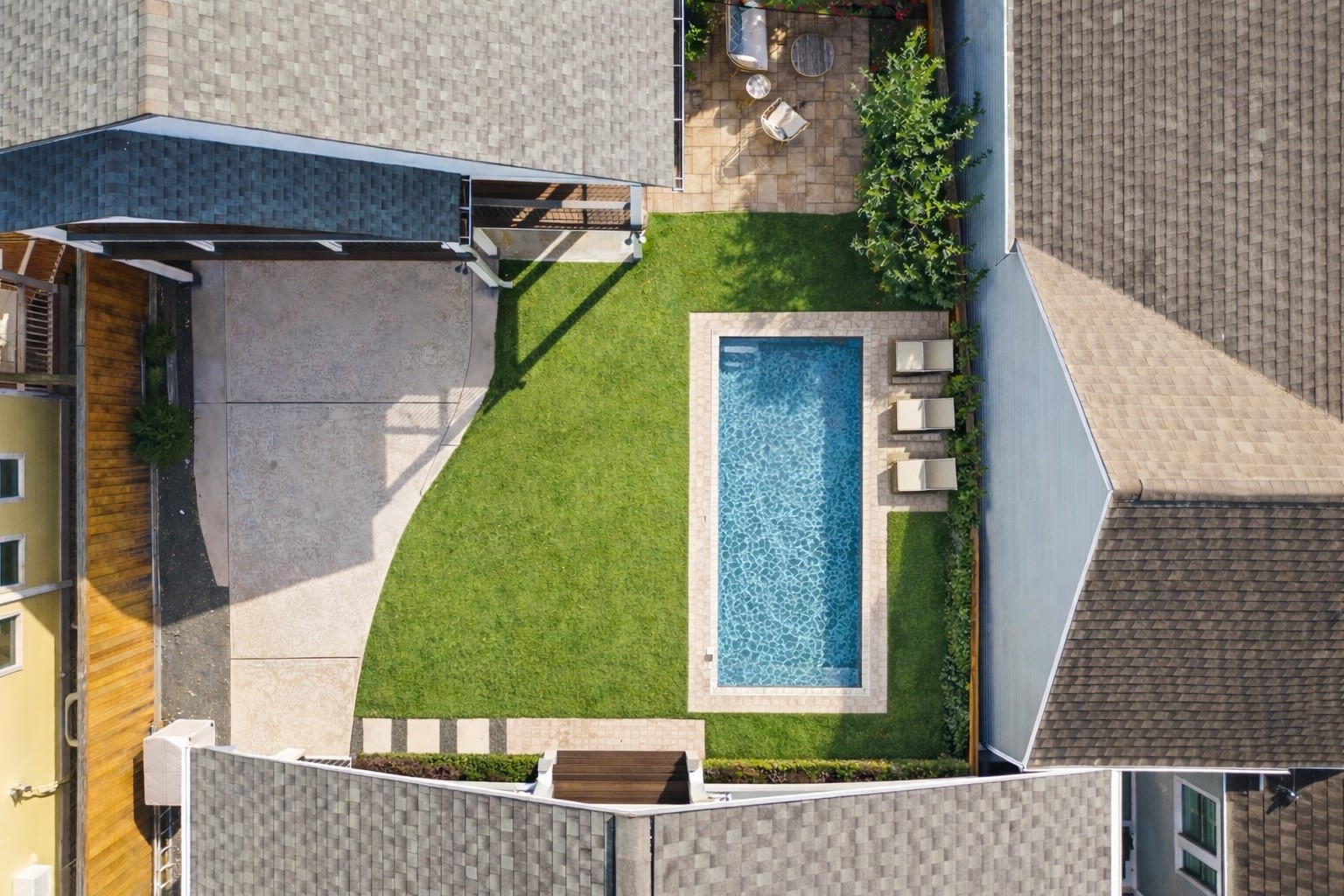 1236 Omar Street Houston, TX 77008 - Photo 41 of 50 **Virtual Rendering** A conceptual rendering showcases the backyard’s potential with a centrally positioned rectangular pool while preserving generous green space for outdoor enjoyment. The layout maintains open lawn areas and clear circulation from the rear stair landing, highlighting how a pool could be thoughtfully integrated without compromising usable yard space.