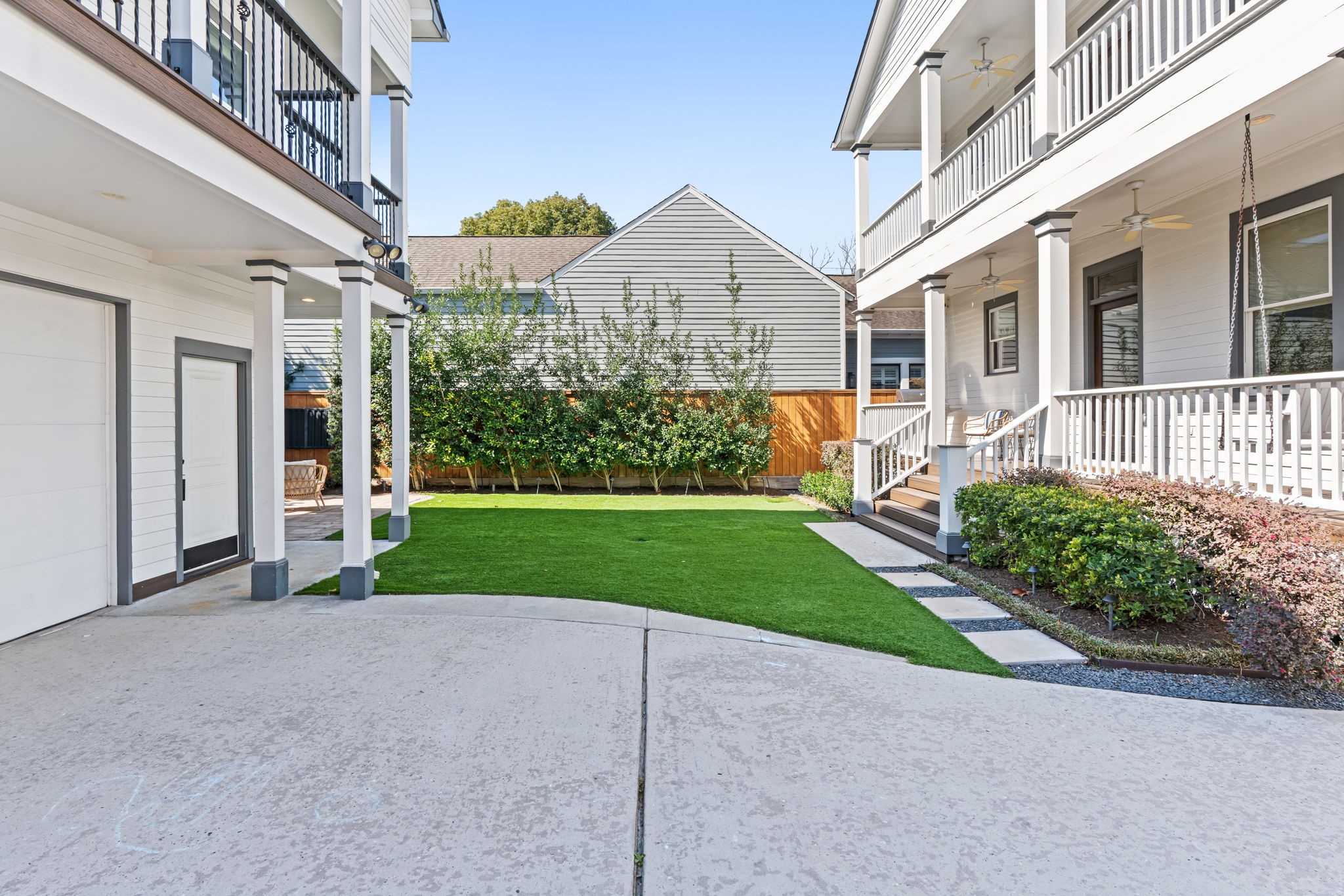 1236 Omar Street Houston, TX 77008 - Photo 43 of 50 The wide driveway provides additional off-street parking and easy access to the detached garage. The open yard layout allows for flexibility rarely found in the neighborhood.