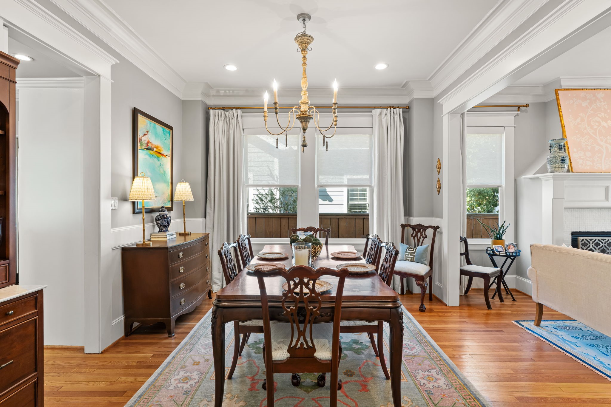1236 Omar Street Houston, TX 77008 - Photo 9 of 50 Positioned between the formal living and kitchen, the dining room offers ideal functionality for entertaining. Hardwood flooring and classic architectural details maintain a cohesive feel throughout the first floor.