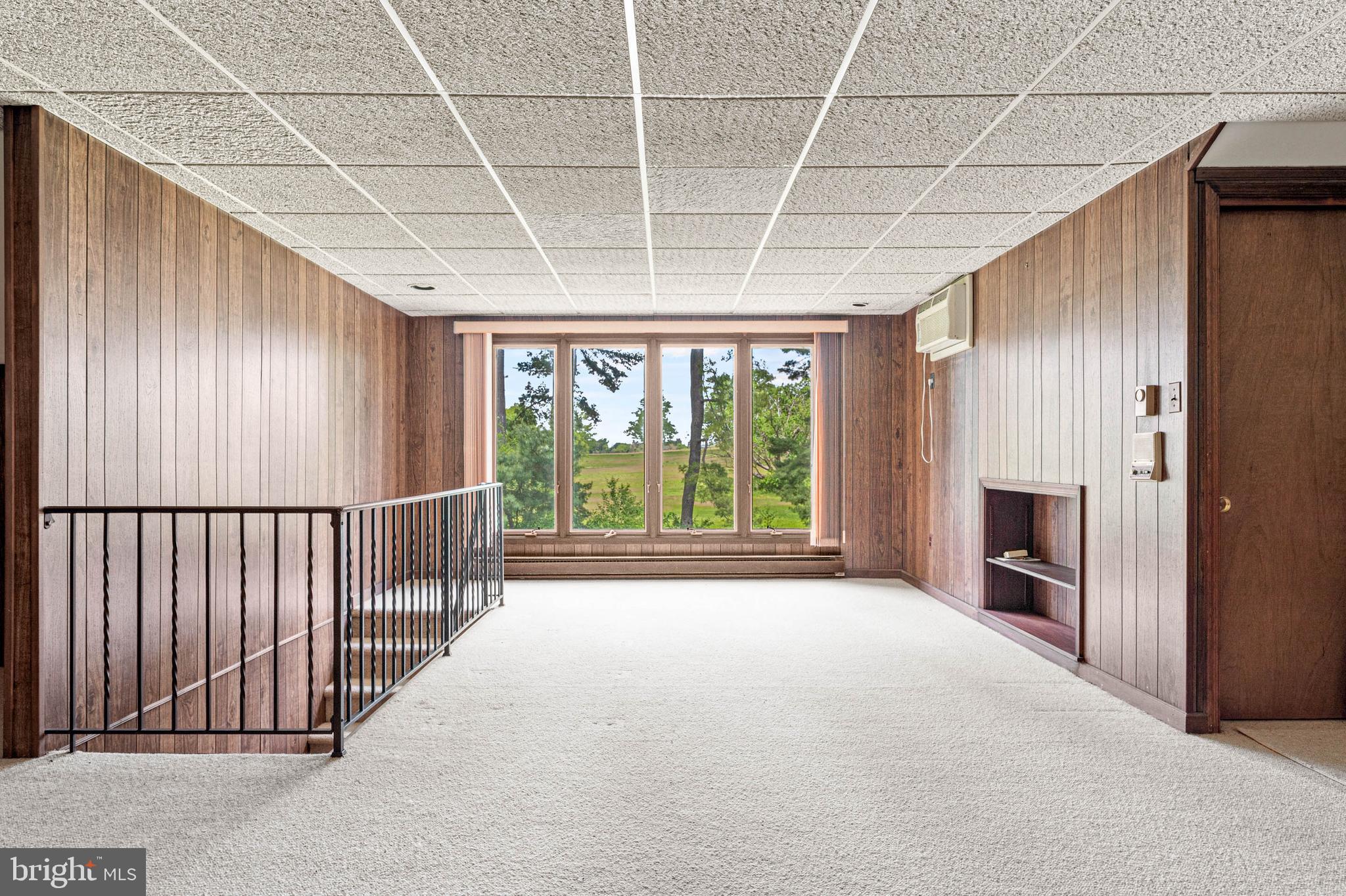 533 Gulph Road Wayne, PA 19087 - Photo 32 of 43 a big room with windows and a fireplace