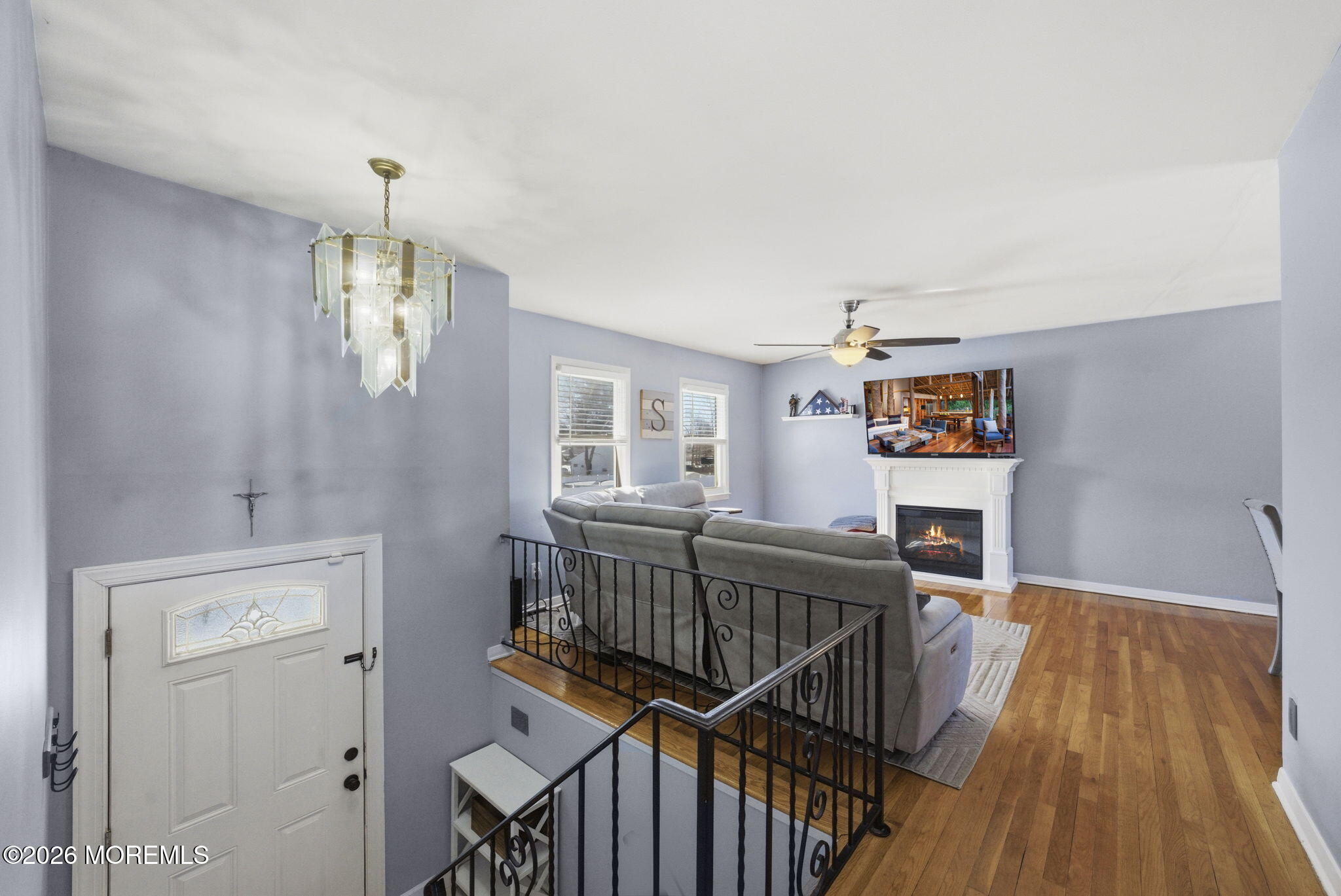 1427 Seminole Road North Brunswick, NJ 08902 - Photo 11 of 45 a view of a hallway with wooden floor and staircase