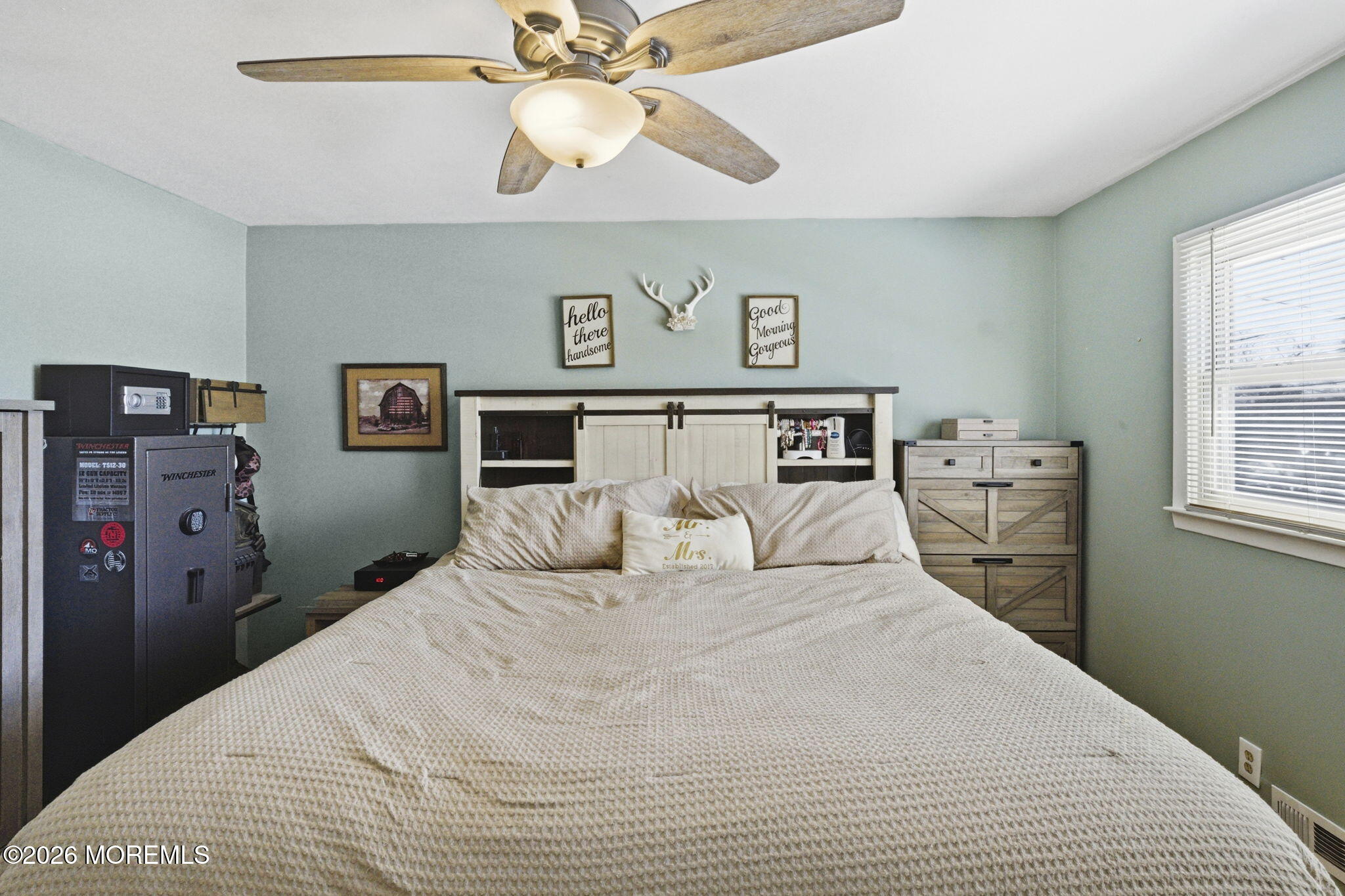 1427 Seminole Road North Brunswick, NJ 08902 - Photo 12 of 45 a bedroom with a bed and a chandelier
