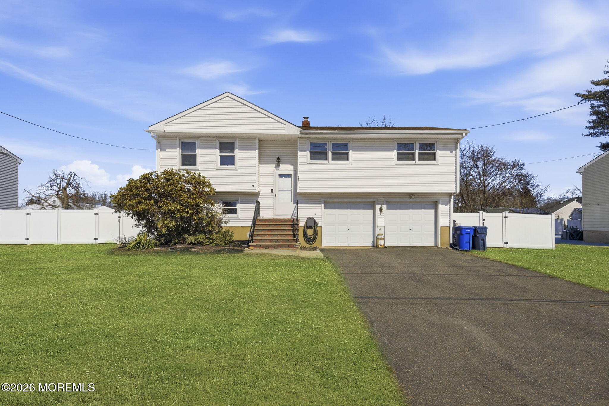 1427 Seminole Road North Brunswick, NJ 08902 - Photo 2 of 45 a front view of a house with a yard and garage