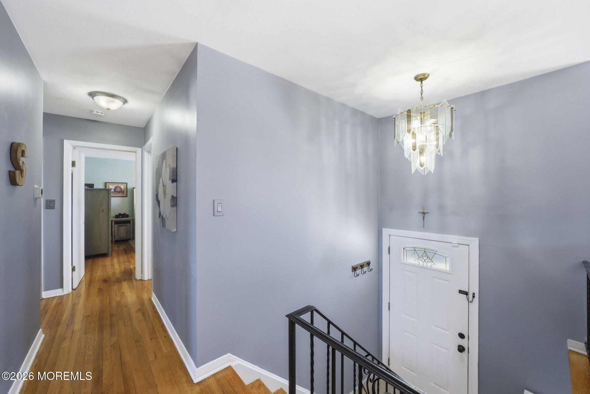 1427 Seminole Road North Brunswick, NJ 08902 - Photo 21 of 45 a view of a hallway with a chandelier
