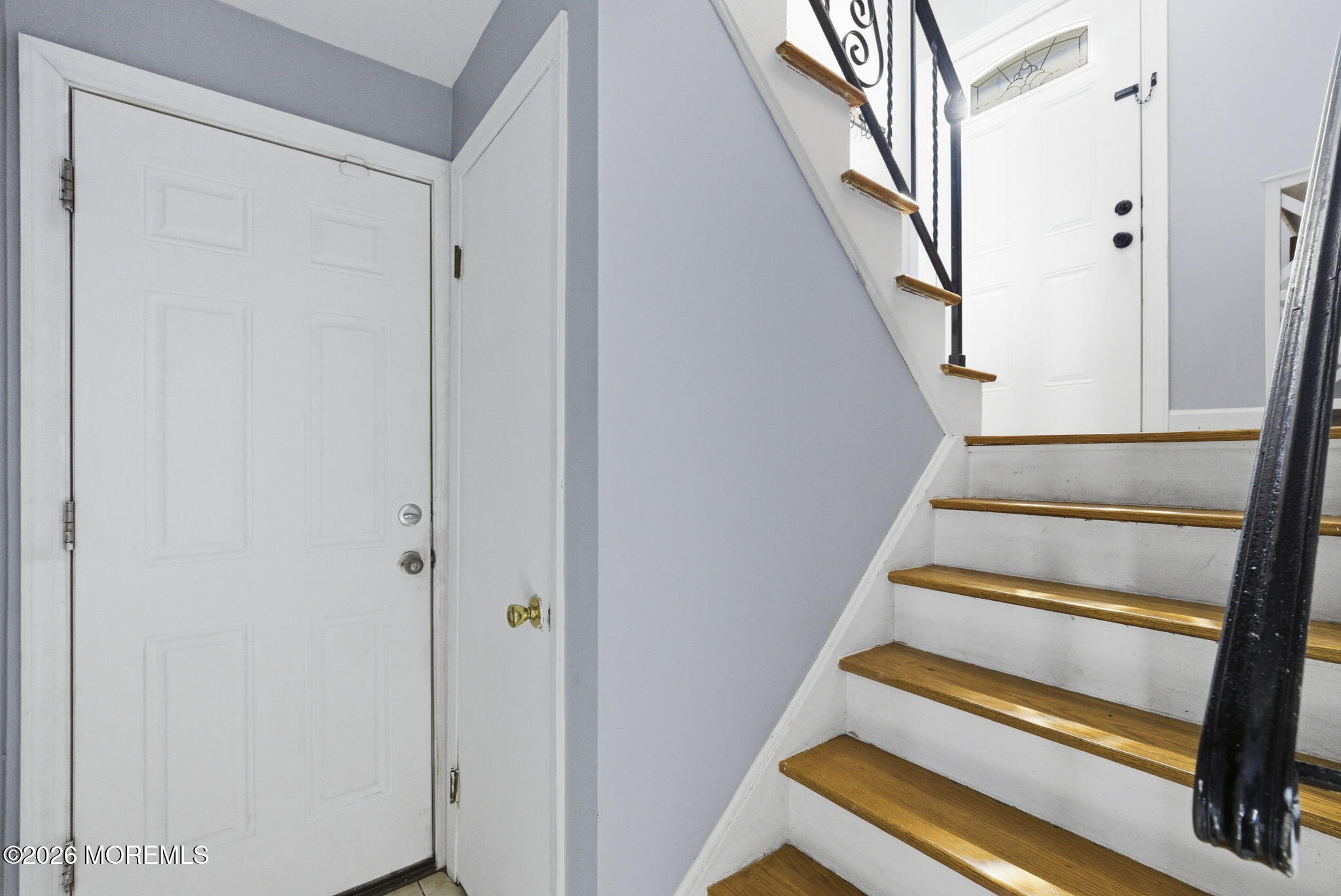 1427 Seminole Road North Brunswick, NJ 08902 - Photo 23 of 45 a view of staircase with wooden floor and white walls