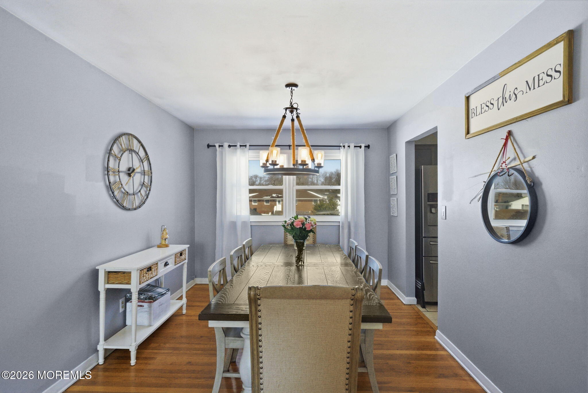 1427 Seminole Road North Brunswick, NJ 08902 - Photo 6 of 45 a dining room with wooden floor a chandelier