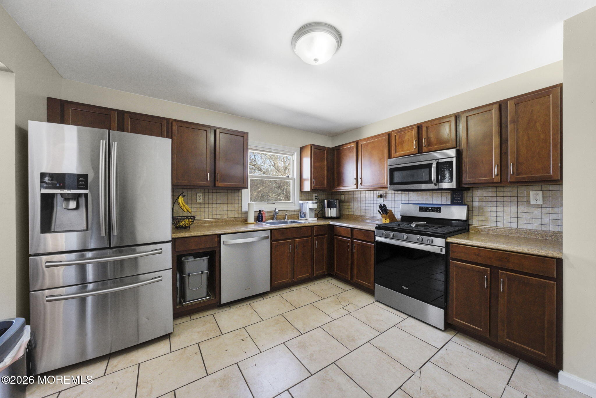 1427 Seminole Road North Brunswick, NJ 08902 - Photo 7 of 45 a kitchen with stainless steel appliances granite countertop a refrigerator stove top oven and sink
