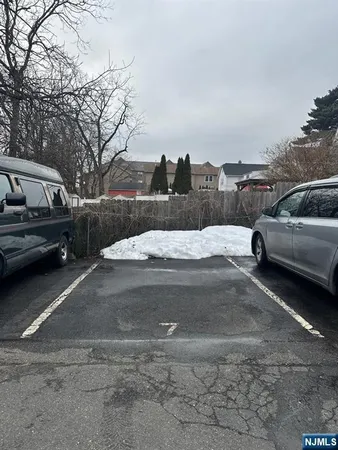 a view of street with parked cars