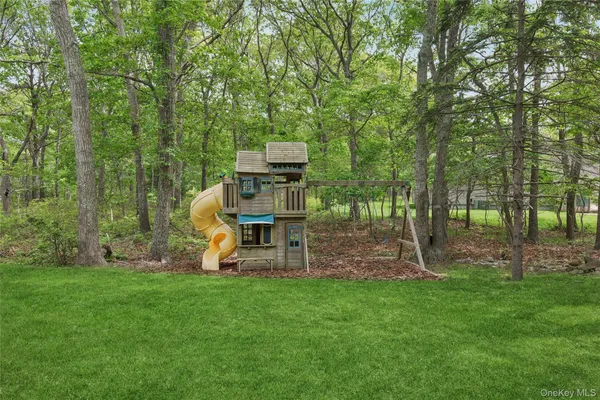 a patio with a table and chairs