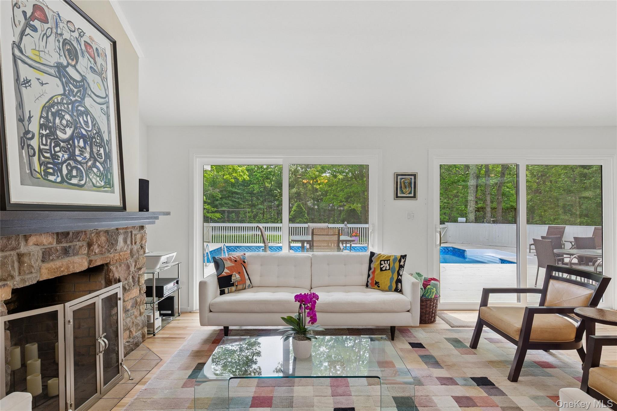 18 Quail Run Hampton Bays, NY 11946 - Photo 17 of 44 a living room with furniture and a fireplace