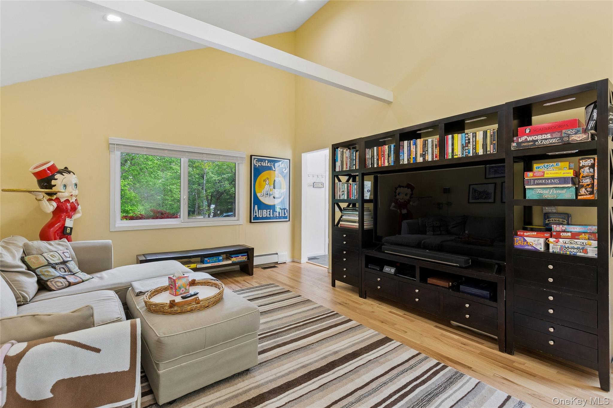 18 Quail Run Hampton Bays, NY 11946 - Photo 24 of 44 a living room with furniture and a flat screen tv