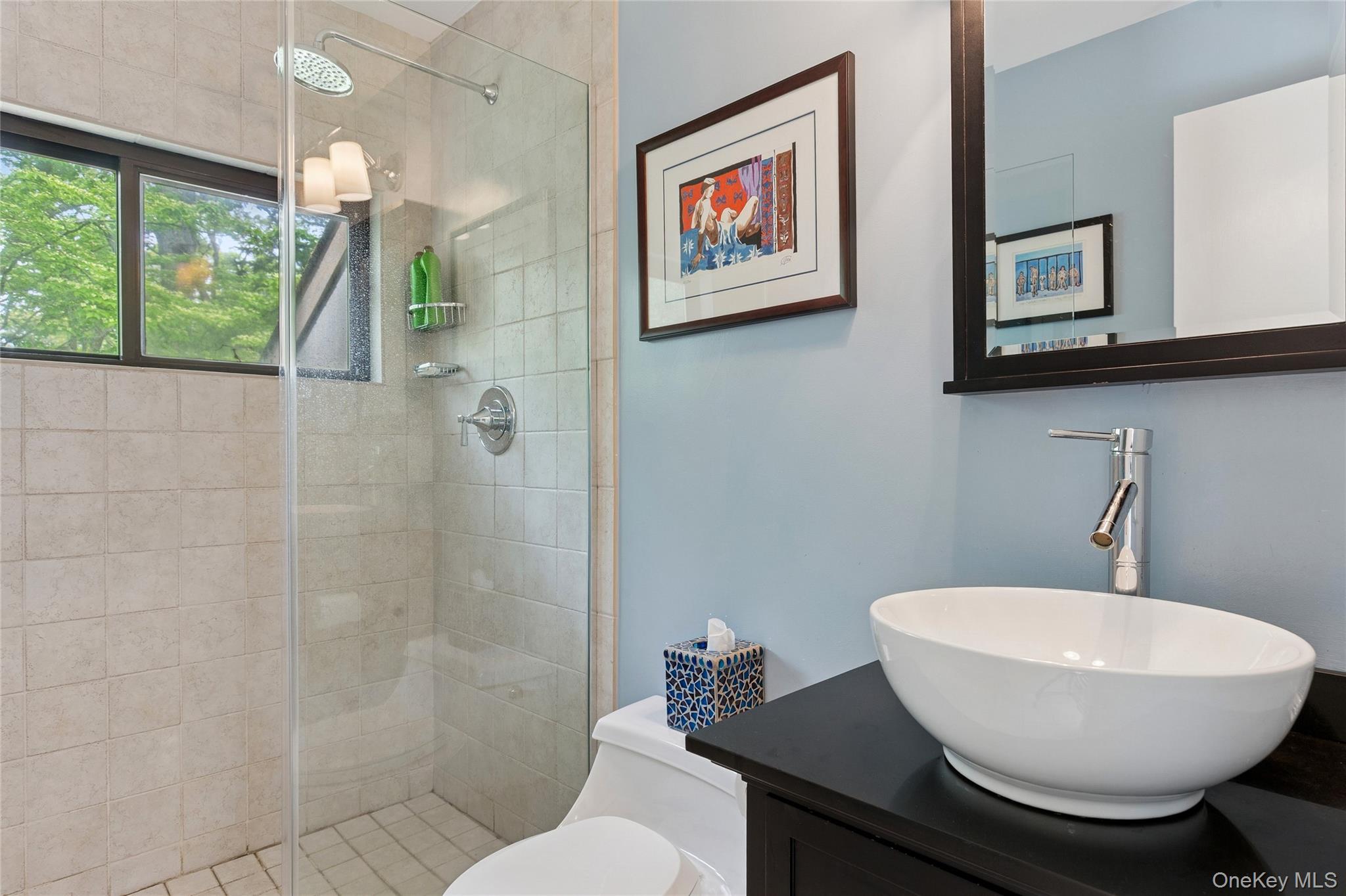 18 Quail Run Hampton Bays, NY 11946 - Photo 31 of 44 a bathroom with a toilet a sink and mirror
