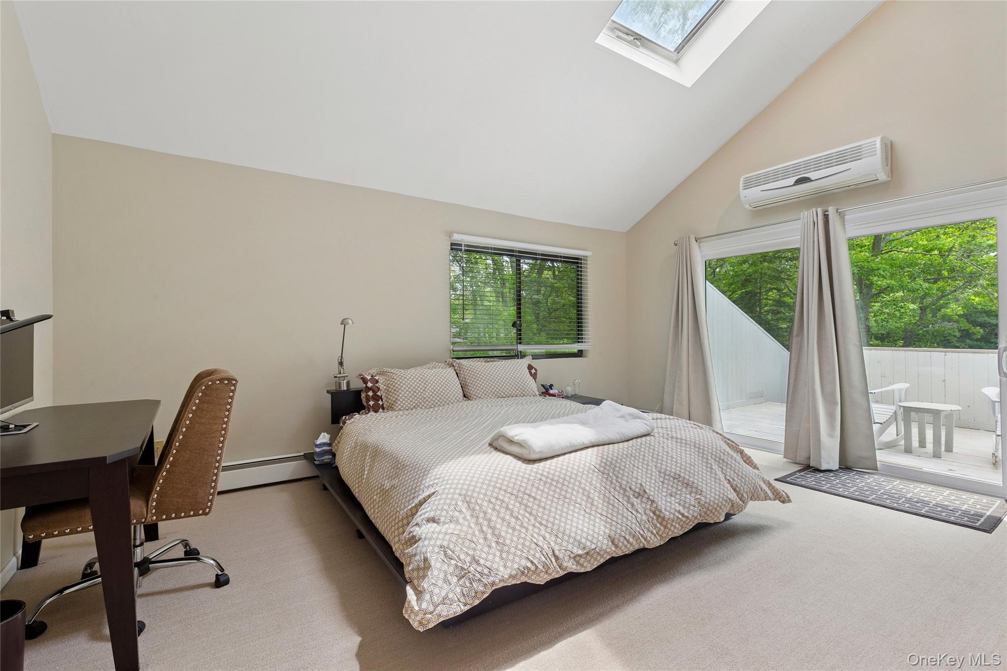 18 Quail Run Hampton Bays, NY 11946 - Photo 33 of 44 a bedroom with a large bed and a window