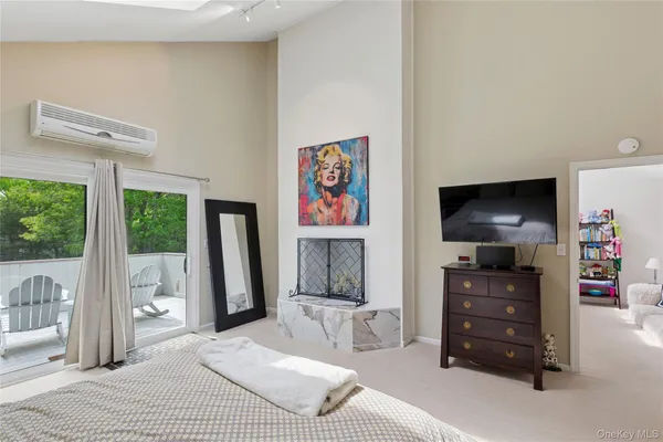 a bathroom with a sink a large mirror and a window