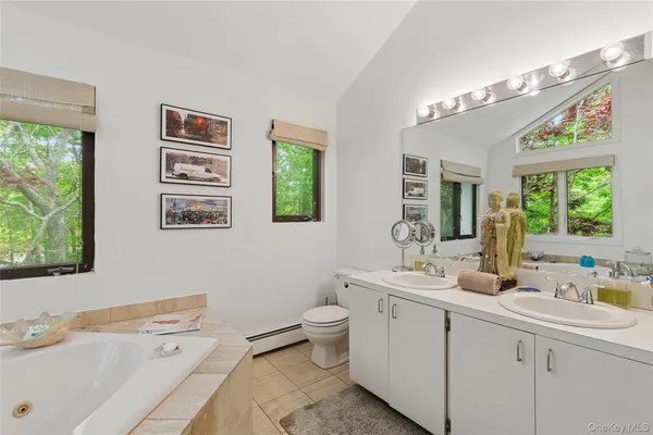 a bath tub sitting next to a window