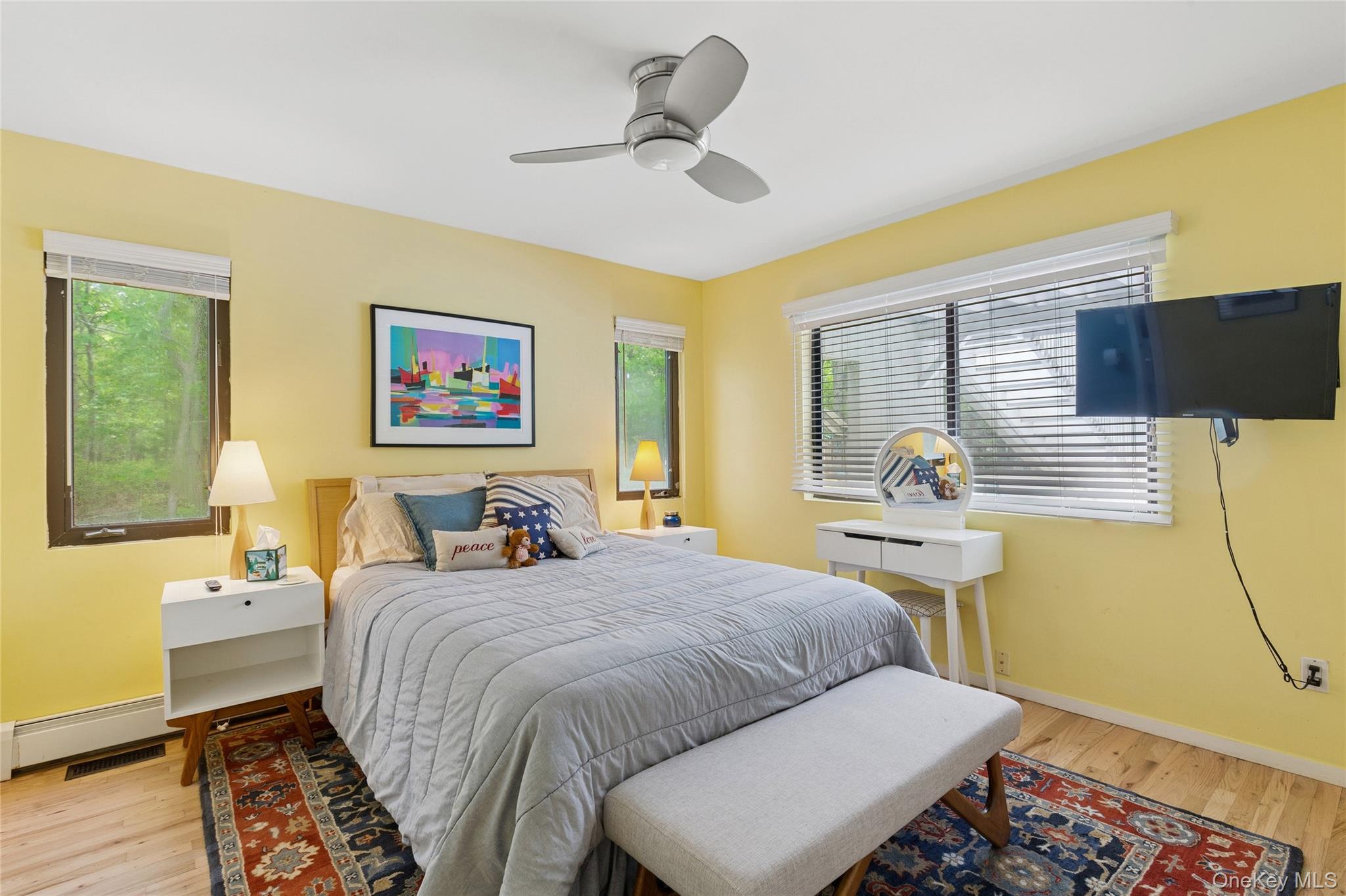 18 Quail Run Hampton Bays, NY 11946 - Photo 40 of 44 a bedroom with a bed and wooden floor