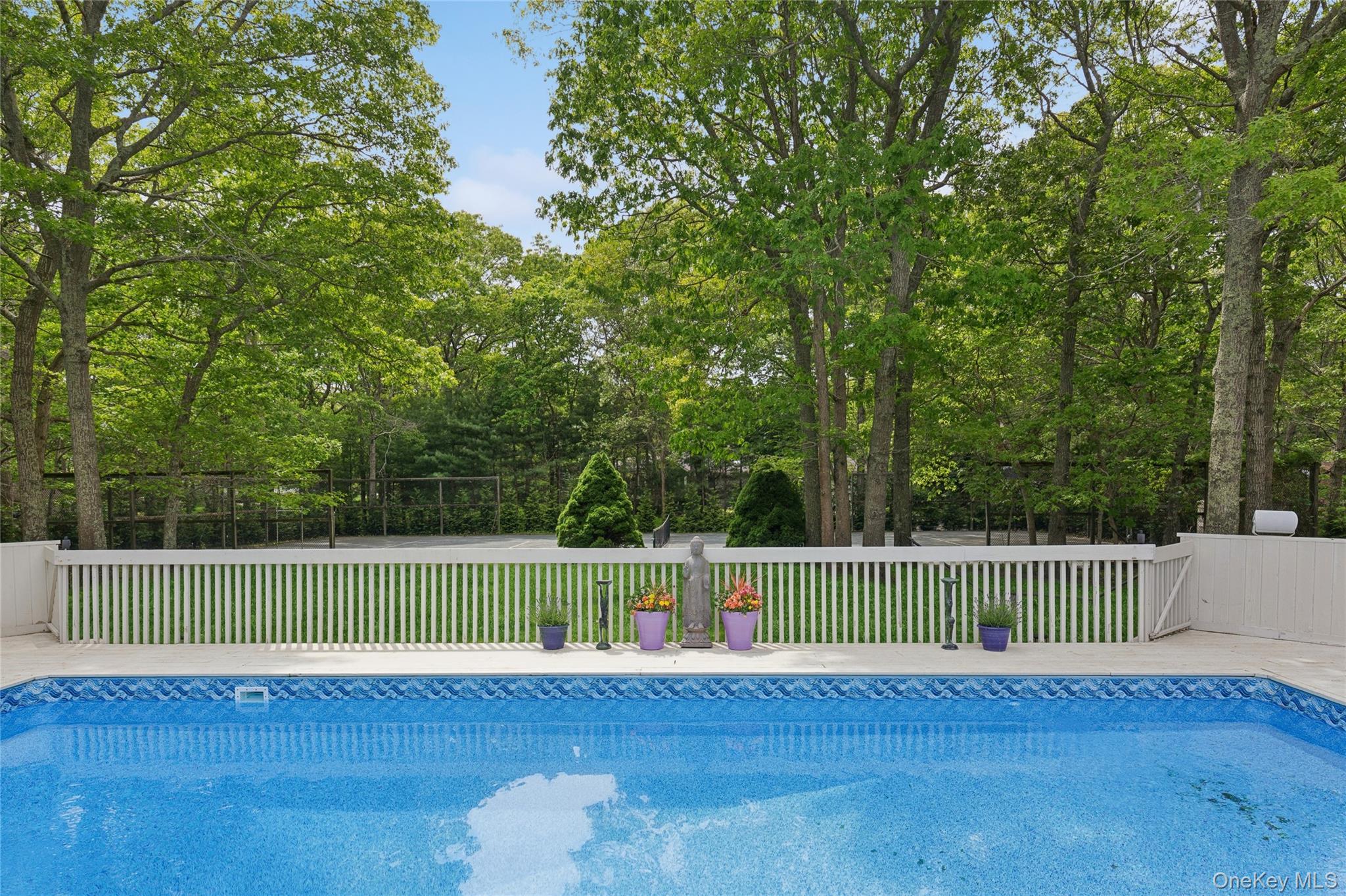 18 Quail Run Hampton Bays, NY 11946 - Photo 7 of 44 a view of a tennis court