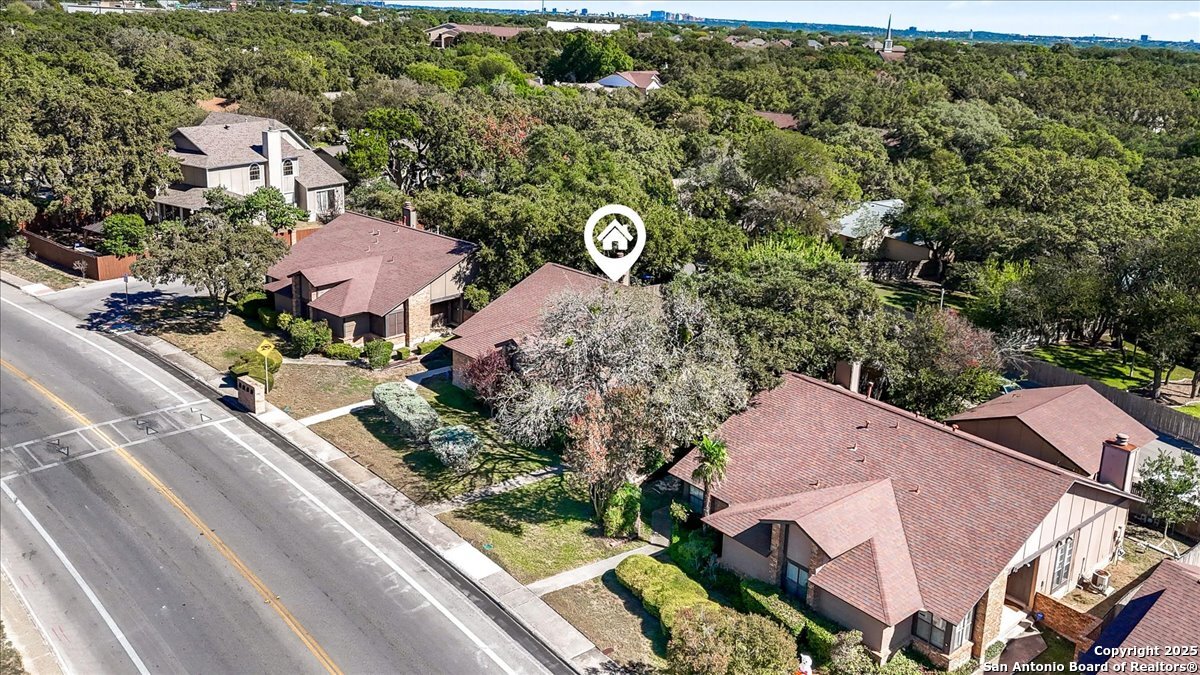 9308 Dover Ridge San Antonio, TX 78250 - Photo 34 of 41 an aerial view of multiple houses with yard