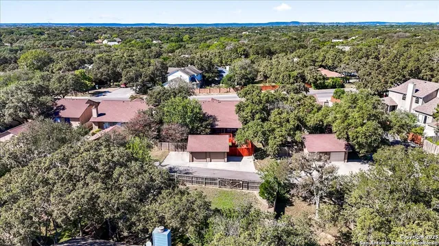 an aerial view of a house with a garden