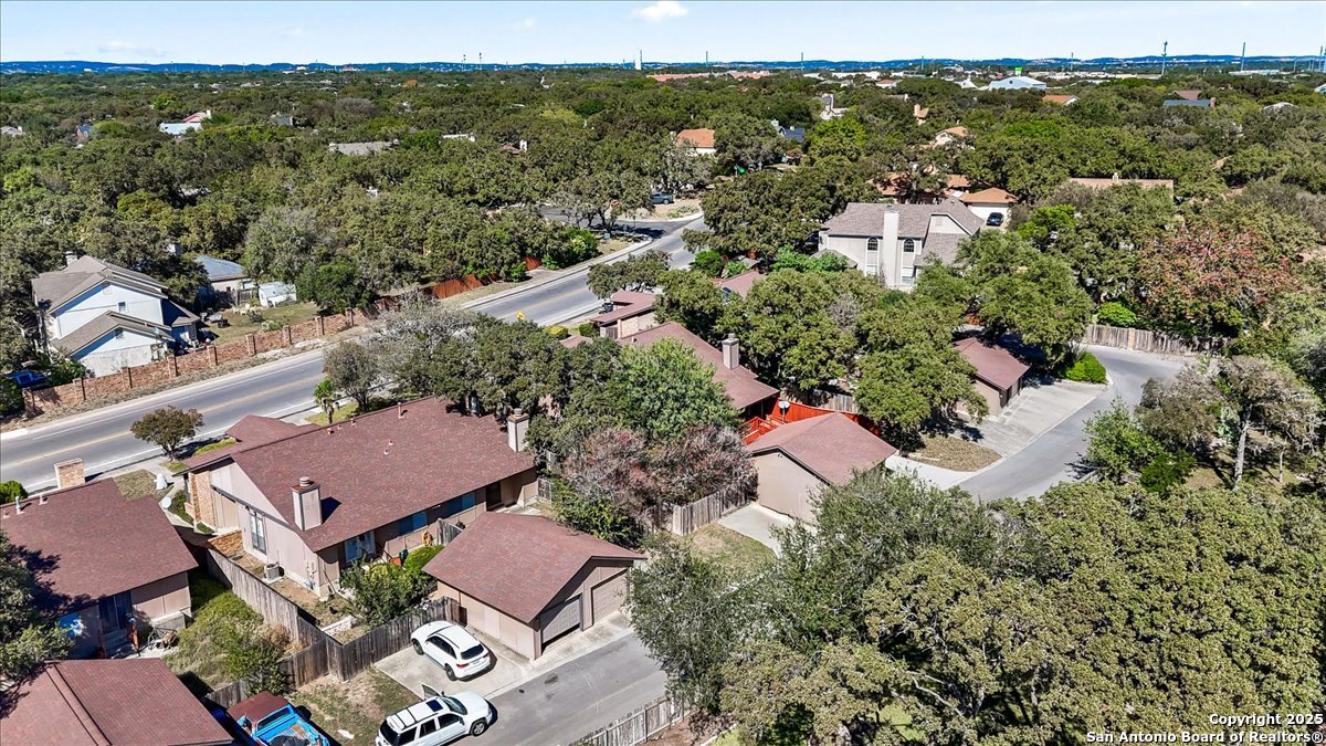9308 Dover Ridge San Antonio, TX 78250 - Photo 38 of 41 an aerial view of residential houses with outdoor space