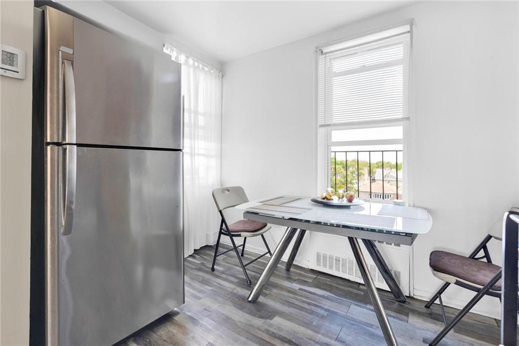 2155 82nd Street, Unit 5D Brooklyn, NY 11214 - Photo 13 of 19 a view of a dining room with furniture window and wooden floor