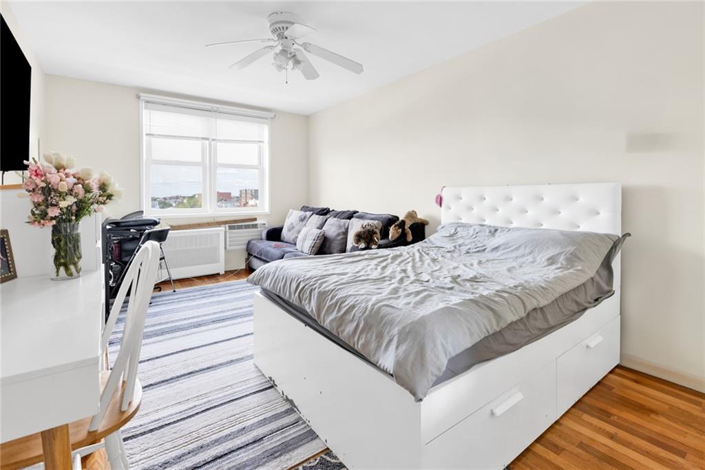 2155 82nd Street, Unit 5D Brooklyn, NY 11214 - Photo 4 of 19 a bedroom with double bed and a window