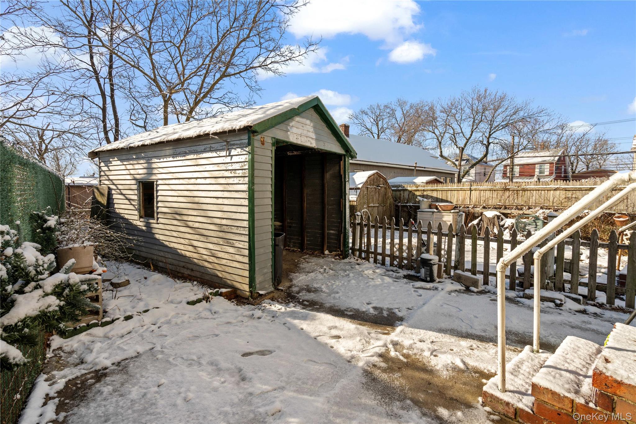 123-10 25th Road Queens, NY 11354 - Photo 27 of 27 View of shed with a fenced backyard