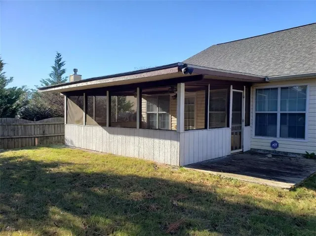 a view of house with backyard and outdoor space
