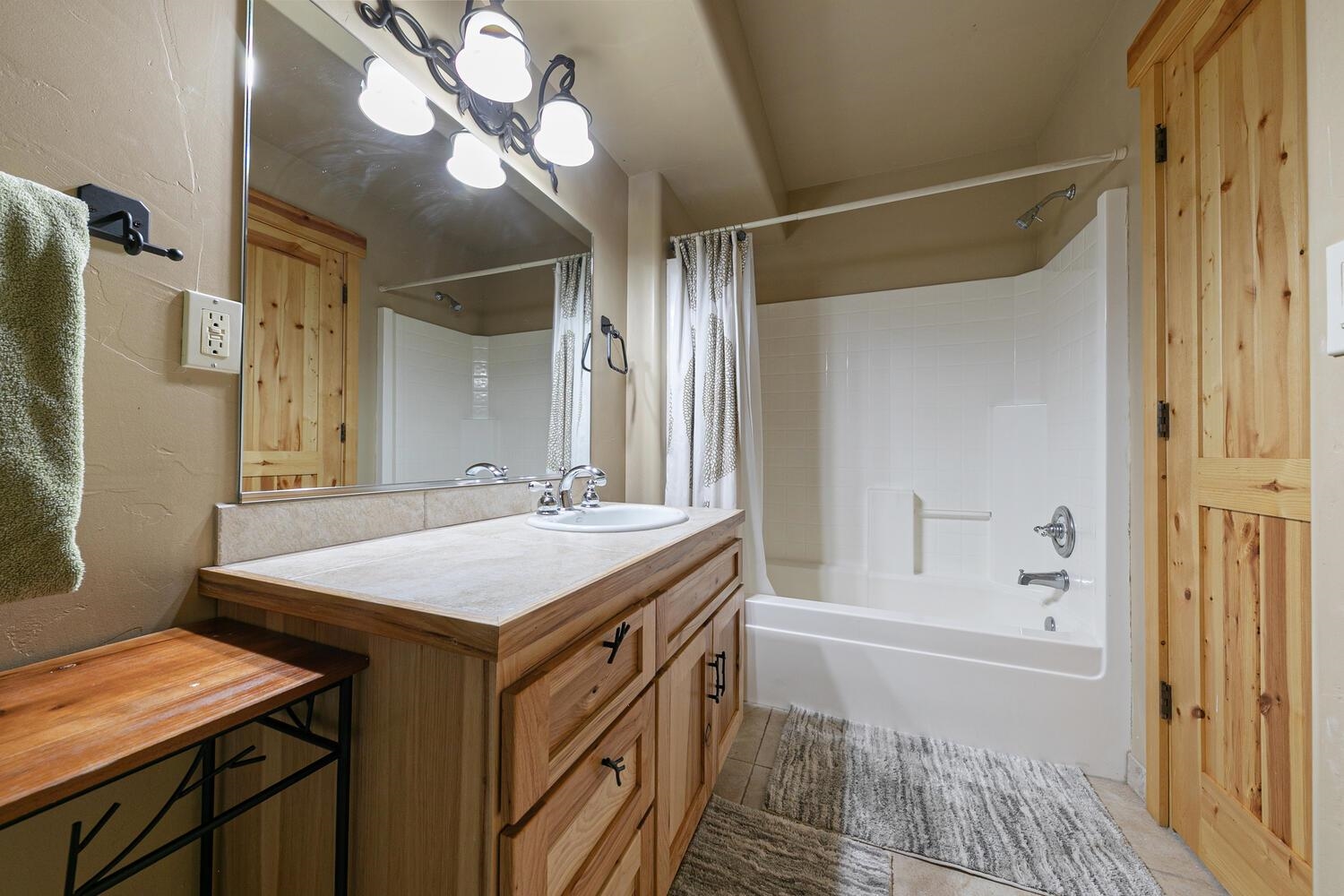 14070 Alder Creek Road Truckee, CA 96161 - Photo 20 of 28 a bathroom with a sink a vanity and a mirror