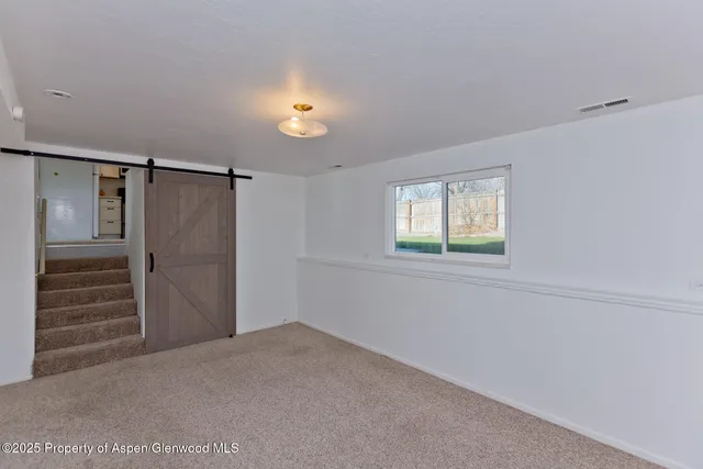 a view of a hallway with staircase