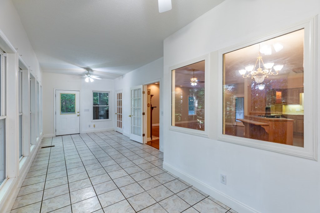 7 Spring Road Blairsville, GA 30512 - Photo 13 of 56 a view of a hallway with wooden floor and a bathroom