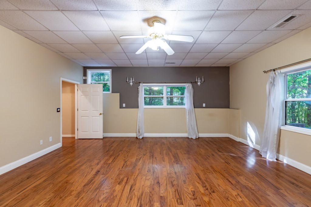 7 Spring Road Blairsville, GA 30512 - Photo 29 of 56 a view of an empty room with wooden floor and a window