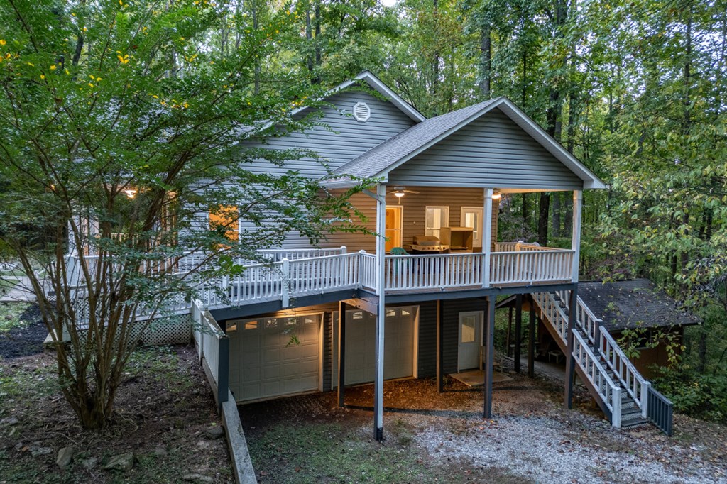 7 Spring Road Blairsville, GA 30512 - Photo 42 of 56 a view of wooden house with a small yard and large trees
